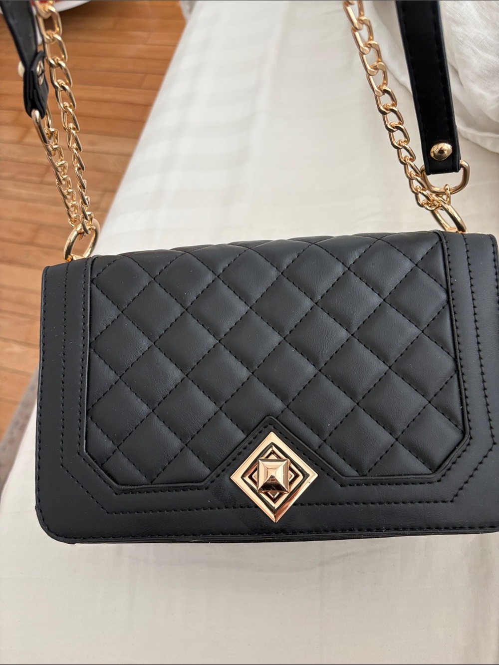 BRAND NEW Travistat black quilted bag with chain and leatherlike strap.